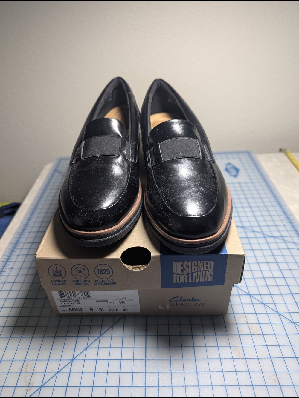 Clarks Black Leather Slip-On Penny Loafers with Brown Trim